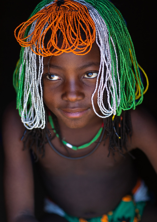 Muhakaona tribe girl with a beaded wig used for the fico ceremony, Cunene Province, Oncocua, Angola