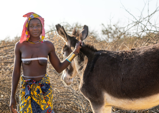 Mucubal tribe woman with a donkey, Namibe Province, Virei, Angola