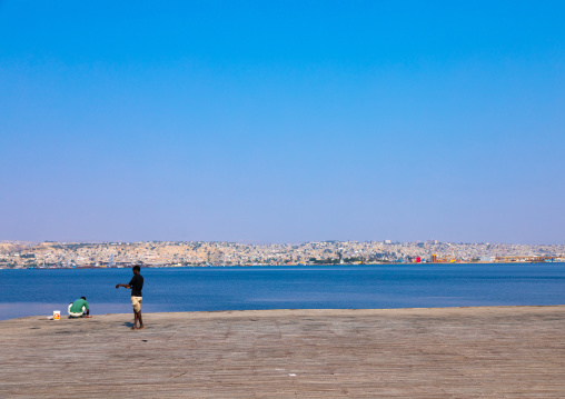 Men fishing on the jetty, Benguela Province, Lobito, Angola