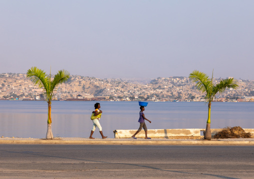 Angolan women walking along the seashore, Benguela Province, Lobito, Angola