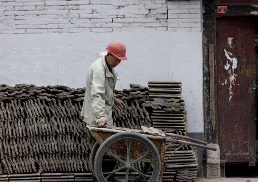 Manual Worker On A Contruction Site, Beijing, China