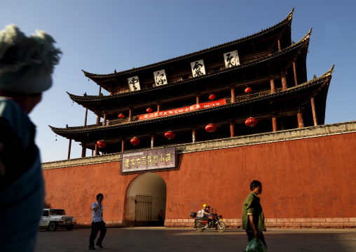 People Passing In Front Of Chaoyang Tower City Gate, Ancient Town, Jianshui, Yunnan Province, China