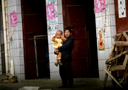 Kid Putting His Fingers In His Ears During A Funeral Procession, Yuanyang, Yunnan Province, China