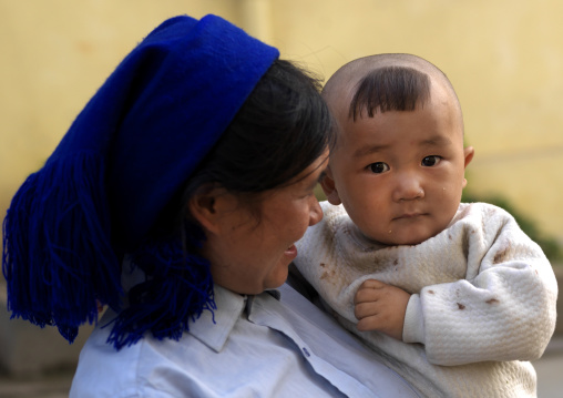 Baby With A Chinese Haricut With His Mother, Yuanyang, Yunnan Province, China