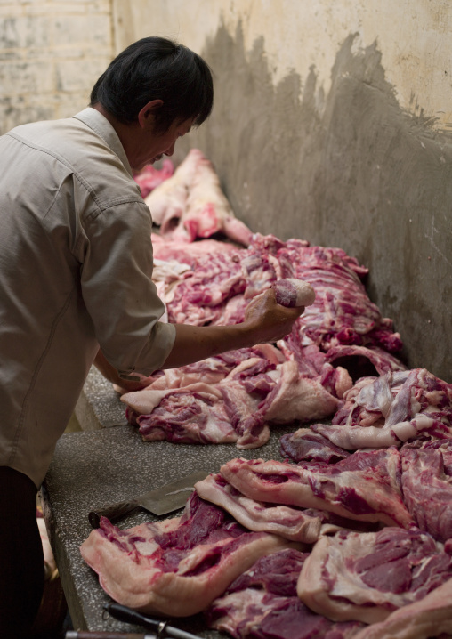 Butcher During Wedding Meal Preparations, Tuan Shan Village, Yunnan Province, China