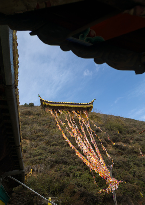 Prayer flags in on a hil in Shachong monastery, Qinghai Province, Wayaotai, China