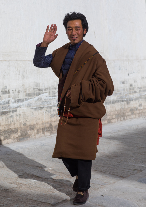 Tibetan man in Rongwo monastery, Tongren County, Longwu, China