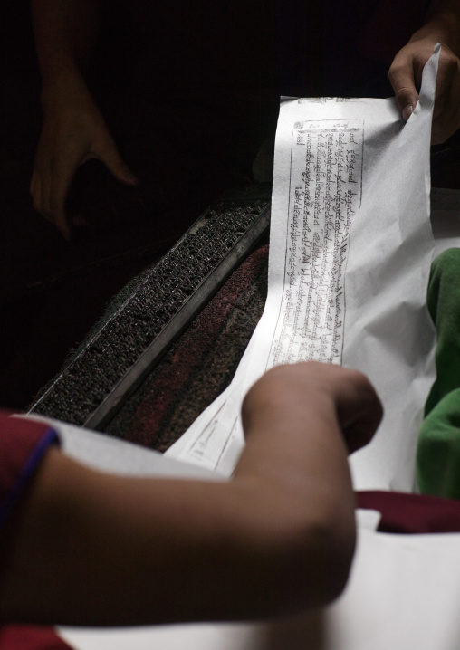 Tibetan scriptures printed from wooden blocks in the monastery traditional printing temple, Gansu province, Labrang, China