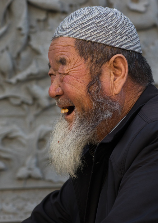 Smiling hui muslim man in the street, Gansu province, Linxia, China