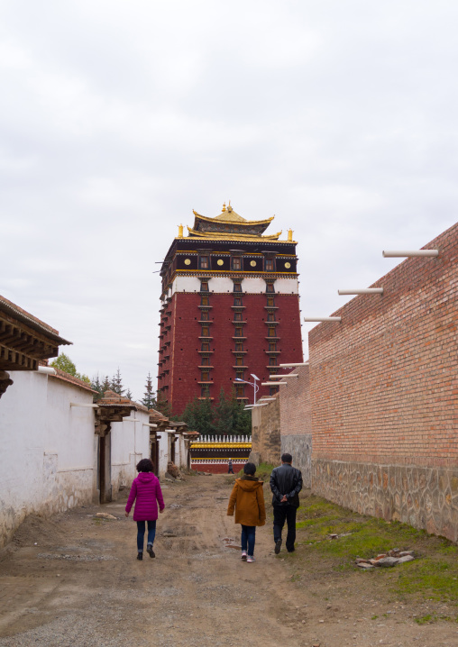 Tibetan pilgrims going to Hezuo monastery and its milarepa tower, Gansu province, Hezuo, China
