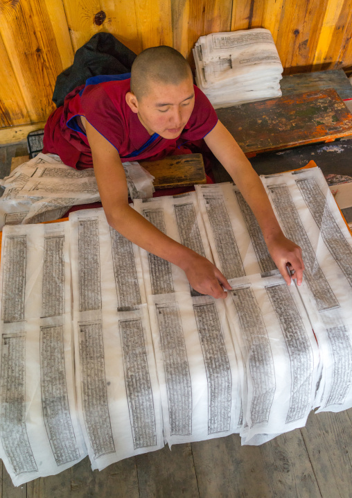 Tibetan scriptures printed from wooden blocks in the monastery traditional printing temple, Gansu province, Labrang, China