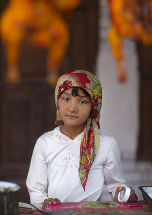 Young Uyghur Girl At Food Stall, Keriya, Old Town, Xinjiang Uyghur Autonomous Region, China