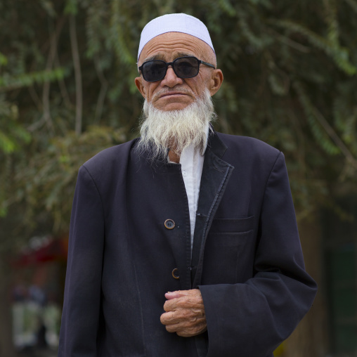 Old Uyghur Bearded Man with sunglasses, Keriya, Xinjiang Uyghur Autonomous Region, China