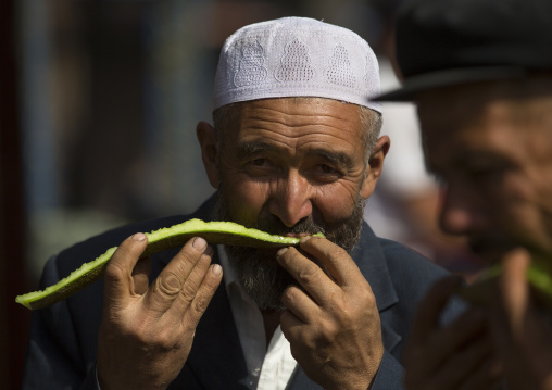 Uyghur Men Eating Watermelon, Serik Buya Market, Yarkand, Xinjiang Uyghur Autonomous Region, China