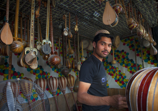 Young Uyghur Man Selling Music Instruments, Yarkand, Xinjiang Uyghur Autonomous Region, China