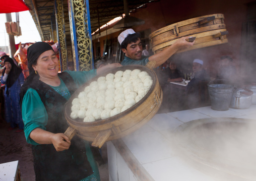 Uyghur Man And Woman Making Dumplings In Serik Buya Market, Yarkand, Xinjiang Uyghur Autonomous Region, China