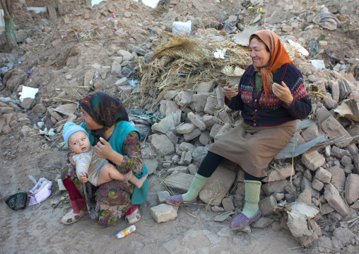 Women And Kid In The Rubbles, Old Town Of Kashgar, Xinjiang Uyghur Autonomous Region, China