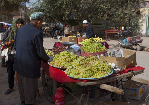 Man Selling Grapes, Kashgar,  Xinjiang Uyghur Autonomous Region, China