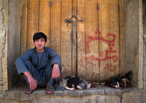 Afghan seller with goats heads, Badakhshan province, Ishkashim, Afghanistan