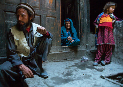 Afghan man with his old mother and his daughter in a pamiri house, Badakhshan province, Qazi deh, Afghanistan