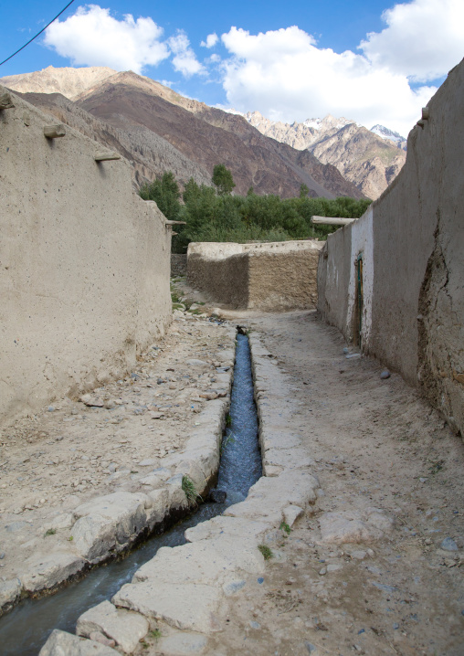 Street with water running in an old adobe village, Badakhshan province, Khandood, Afghanistan