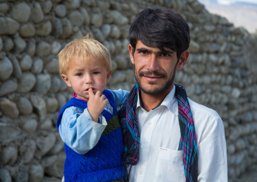 Portrait of an afghan boy with blonde hair with his father, Badakhshan province, Khandood, Afghanistan