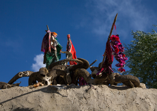 Flags and ibex horns on the top of an old shrine, Badakhshan province, Khandood, Afghanistan