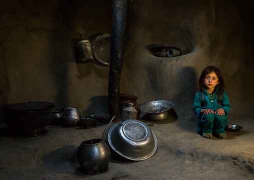 Afghan girl inside a traditional pamiri kitchen, Badakhshan province, Khandood, Afghanistan