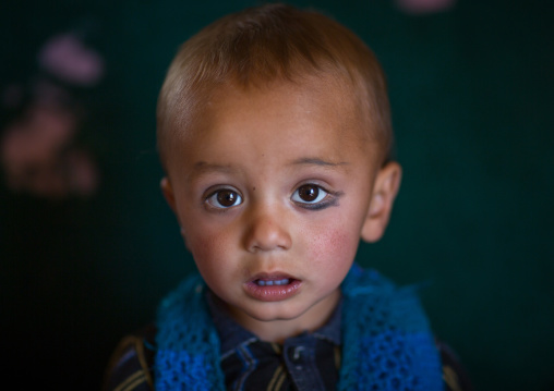 Portrait of an afghan boy with khol on one eye, Badakhshan province, Zebak, Afghanistan