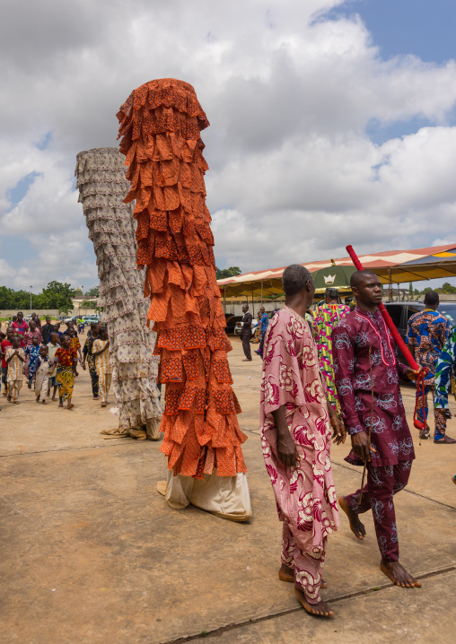 Benin, West Africa, Porto-Novo, men guiding a zangbeto guardian of the night spirit