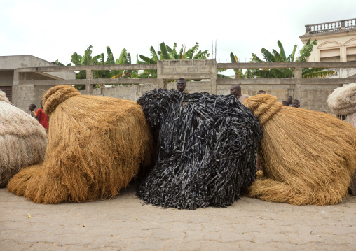 Benin, West Africa, Porto-Novo, zangbetos guardians of the night spirit resting in the street