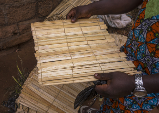 Benin, West Africa, Adjara, man buying a mat used in voodoo ceremonies