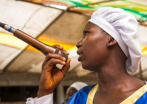 Benin, West Africa, Ganvié, celestial church of christ woman praying and singing