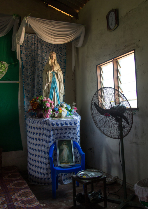 Benin, West Africa, Ganvié, virgin maria statue inside a house on lake nokoue