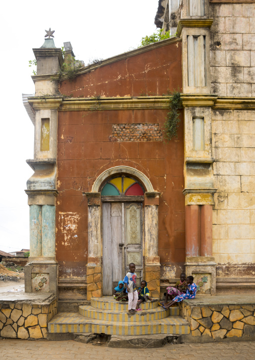 Benin, West Africa, Porto-Novo, children sit on the stairs of the central mosque