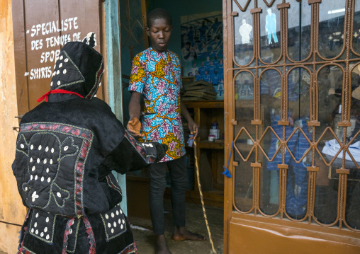 Benin, West Africa, Porto-Novo, egoun egoun spirit of the deads asks money to a taylor in exchange of blessings