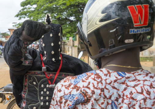 Benin, West Africa, Porto-Novo, egoun egoun spirit of the deads asks money to a man in exchange of blessings