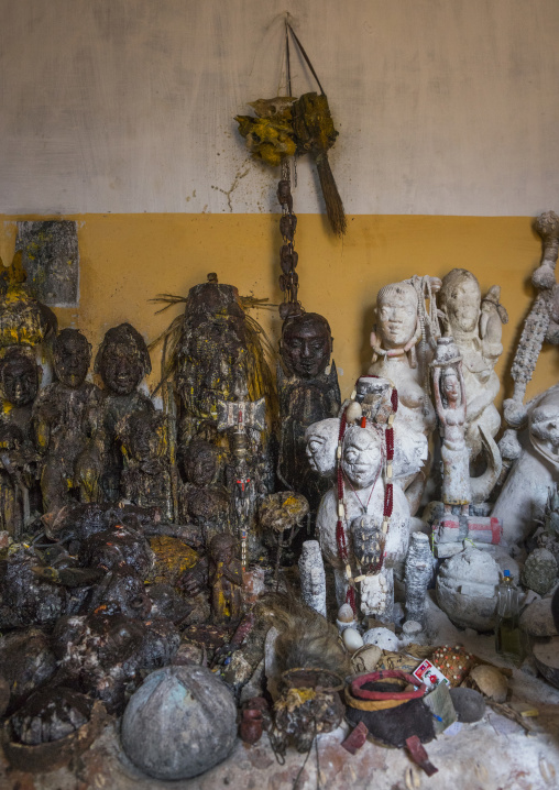 Benin, West Africa, Bonhicon, statues covered with oil and blood inside a voodoo temple for a ceremony