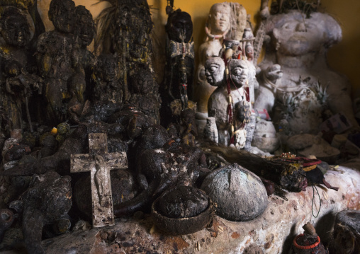 Benin, West Africa, Bonhicon, statues covered with oil and blood inside a voodoo temple for a ceremony