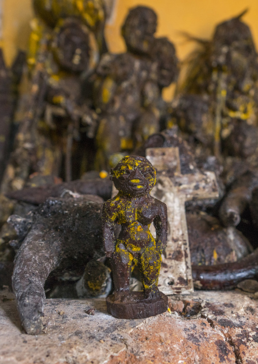 Benin, West Africa, Bonhicon, statues covered with oil and blood inside a voodoo temple for a ceremony