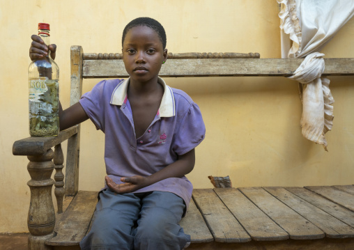 Benin, West Africa, Bonhicon, virgin girl assisting the priest during a voodoo ceremony