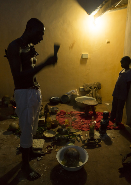 Benin, West Africa, Bonhicon, kagbanon bebe voodoo priest praying in the night during a ceremony