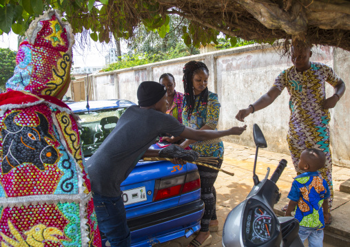 Benin, West Africa, Porto-Novo, egoun egoun spirit of the deads asks money to people in exchange of blessings
