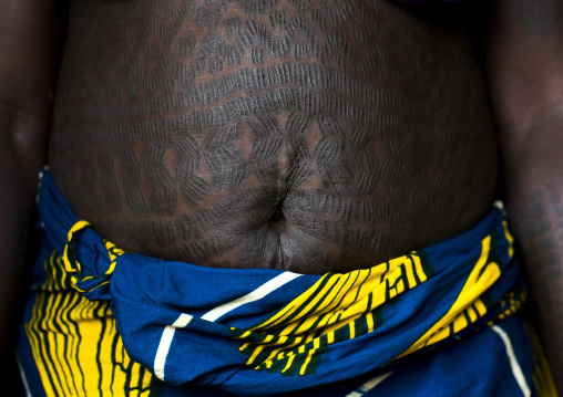 Benin, West Africa, Onigbolo Isaba, holi tribe woman belly covered with traditional tattoos and scars made with a little knife