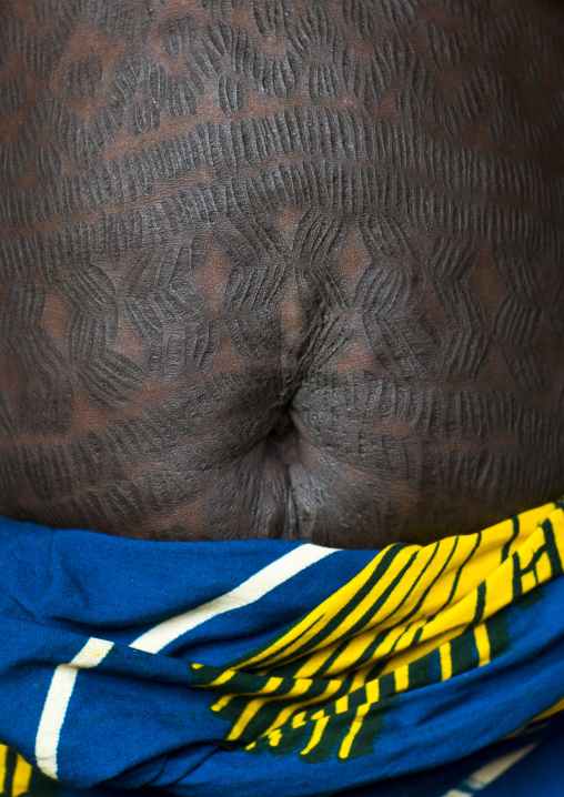 Benin, West Africa, Onigbolo Isaba, holi tribe woman belly covered with traditional tattoos and scars made with a little knife