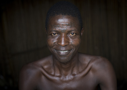 Benin, West Africa, Onigbolo Isaba, holi tribe man covered with traditional facial tattoos and scars portrait