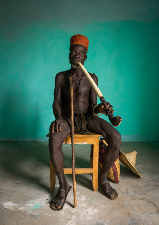 Benin, West Africa, Taneka-Koko, traditional healer called mister tcholi with his giant pipe