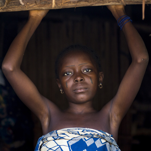 Benin, West Africa, Onigbolo Isaba, holi tribe girl with traditional facial tattoos and scars