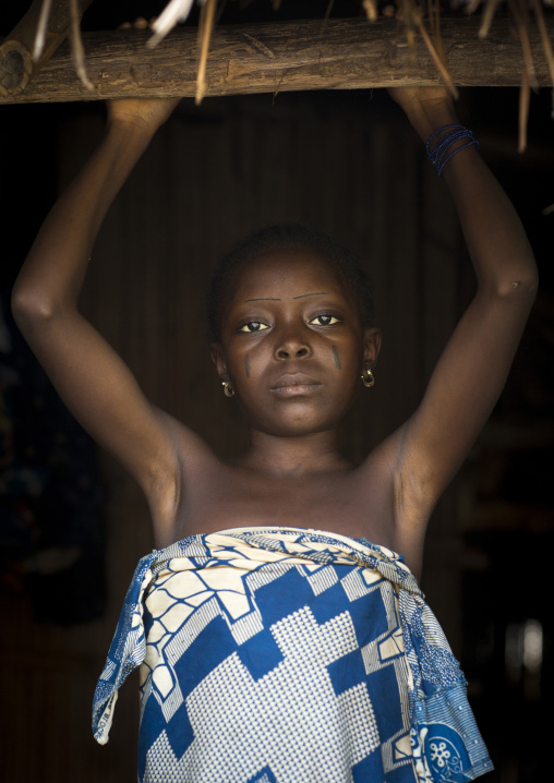 Benin, West Africa, Onigbolo Isaba, holi tribe girl with traditional facial tattoos and scars