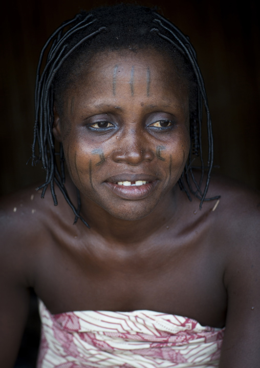 Benin, West Africa, Onigbolo Isaba, holi tribe woman covered with traditional facial tattoos and scars